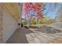 Attached two-car garage with ample driveway space in a suburban setting at 104 Pine Pt, Peachtree City, GA 30269