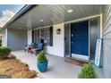 Inviting front porch featuring comfortable seating, stylish decor, and a welcoming ambiance at 3685 Concordia Rd, Decatur, GA 30034