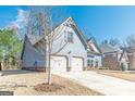 Charming two-story home with a spacious two-car garage and well-maintained lawn at 4050 Villagewood Ln, Ellenwood, GA 30294