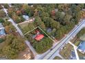 Aerial view of the property's boundaries nestled among mature trees, close to main thoroughfare at 111 Highway 138 E, Stockbridge, GA 30281