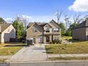 Charming two-story home with a well-maintained lawn and a two-car garage in a suburban setting at 6870 Diamond Dr, Rex, GA 30273