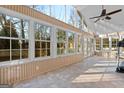 Bright sunroom with tile flooring and a ceiling fan at 140 Jodeco Station Ter, Stockbridge, GA 30281