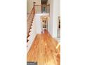 Bright foyer with hardwood floors, staircase, and balcony overlooking the entry at 3626 Lone Indian Trl, Marietta, GA 30066
