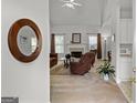 Bright living room with a fireplace, neutral carpet, and comfortable, contemporary furnishings at 116 Evenview Dr., Jonesboro, GA 30236