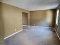 Spacious living room with neutral carpet and fresh paint, ready for personalization at 6733 Jojanne Ln, Lithonia, GA 30038