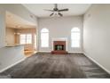 Spacious living room with a fireplace, large windows, and an open floor plan at 364 Valleyside Dr, Dallas, GA 30157