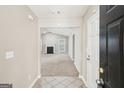 Inviting entryway that opens to the spacious living area with a fireplace at 3396 Framingham Dr, Lithonia, GA 30038