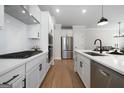 Well-equipped kitchen with stainless steel appliances, quartz countertops and ample cabinet space at 807 Stickley Oak Way, Woodstock, GA 30189