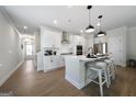 Bright, open kitchen with a large island, stainless steel appliances, and modern finishes at 807 Stickley Oak Way, Woodstock, GA 30189