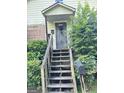 Front steps leading up to the entrance of the home, framed by lush greenery at 466 Joseph E Lowery Nw Blvd, Atlanta, GA 30314