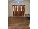 Inviting entryway with striking stained glass double doors and wood flooring at 2791 Biscayne Dr, Conyers, GA 30012