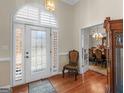 Charming foyer featuring hardwood floors and a decorative glass front door at 200 Magnolia Ct, Mcdonough, GA 30252