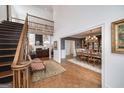 Spacious living area with a staircase, balcony, fireplace and dining area perfect for both relaxing and entertaining at 3320 Lost Valley Dr, Jonesboro, GA 30236