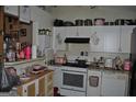 Functional kitchen with white appliances, ample counter space, and white cabinets offering storage solutions at 121 Juniper Dr, Mcdonough, GA 30253