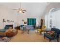 Cozy living room with a fireplace, plush seating, and natural light, ideal for entertaining guests at 2733 Newtons Crest Cir, Snellville, GA 30078