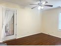 Cozy bedroom featuring a ceiling fan, natural light and access to the backyard at 6544 Bussell Way, Riverdale, GA 30274