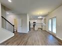 Open-concept layout seamlessly connects the living area to the kitchen and dining space at 461 Best Friends Turn Aly, Mcdonough, GA 30252