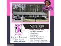 Exterior of open house listing: Landscaped single story home with 3 bedrooms and a 2-car garage at 2387 Shire Ct, Austell, GA 30106