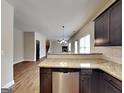 Modern kitchen with granite countertops, stainless steel appliances, and dark cabinetry at 483 Castle Top Ln, Lawrenceville, GA 30045