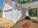 Spacious detached two-car garage features ample storage and convenient access to the home at 1293 Coan Dr, Locust Grove, GA 30248