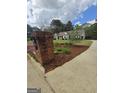 Brick mailbox with landscaped flowerbed leading to a single-story home at 248 Valley Way, Hampton, GA 30228