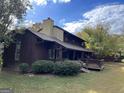 Exterior view of home featuring a private deck and traditional architecture at 20 Fairway Ln, Peachtree City, GA 30269