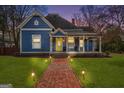 Charming two-story home with a brick pathway and manicured lawn at 85 Bryan St, Mcdonough, GA 30253