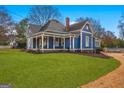 Charming two-story home with a manicured lawn and inviting curb appeal at 85 Bryan St, Mcdonough, GA 30253