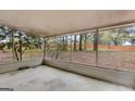 Enclosed porch offers a serene view of the backyard, ideal for outdoor relaxation and enjoyment at 324 Sue Ct, Temple, GA 30179