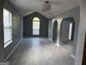 Spacious living room featuring tile floors, modern lighting, and arched doorways at 2160 Creekview Trl, Decatur, GA 30035
