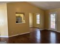 Bright living room with vaulted ceiling, hardwood floors, and access to outdoor deck at 5734 Wellborn Oaks Ct, Lithonia, GA 30058