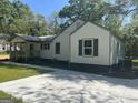 A charming single-story house with neutral siding and dark shutters at 5122 Hillcrest Nw Dr, Covington, GA 30014