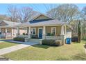 Attractive bungalow featuring a welcoming front porch, well-maintained lawn, and pleasant curb appeal at 988 Allene Sw Ave, Atlanta, GA 30310