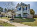 Well-maintained home showcasing beautiful siding, manicured lawn, and inviting curb appeal on a sunny day at 509 Cowpens Rd, Social Circle, GA 30025