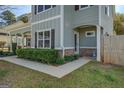 Well-maintained home exterior featuring a welcoming side entrance and lush landscaping at 509 Cowpens Rd, Social Circle, GA 30025