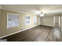Spacious living room featuring modern flooring, natural light, and an open layout at 1809 Mornington Ln, Snellville, GA 30078