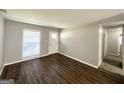 Inviting living room boasts updated floors, neutral colors, and abundant natural light at 2566 Nw Santa Barbara Dr, Atlanta, GA 30318