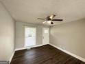 Bright bedroom with hardwood floors, a window, and neutral paint color at 3566 Fairlane Nw Dr, Atlanta, GA 30331