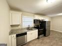 Modern kitchen with stainless steel appliances and granite countertops at 518 Hammett Dr, Decatur, GA 30032
