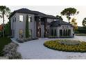Beautiful two-story home with gray brick exterior and modern landscaping at 2704 Antioch Ne St, Conyers, GA 30013