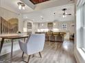 Elegant kitchen featuring pendant lighting, island with seating, and stainless appliances at 4 & 5 Northlake Cir, Peachtree City, GA 30269