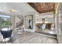 Bright living room featuring hardwood floors and an open floorplan to kitchen at 4 & 5 Northlake Cir, Peachtree City, GA 30269