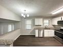 Modern kitchen with stainless steel appliances, granite countertops, and lots of natural light at 2317 Emerald Springs Dr, Decatur, GA 30035
