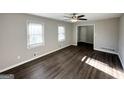 Inviting living room featuring new flooring, neutral walls, and bright windows at 2317 Emerald Springs Dr, Decatur, GA 30035