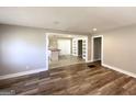 Open-concept living space with hardwood floors offering a seamless flow to the kitchen at 2676 Stone Rd, East Point, GA 30344
