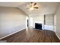 Spacious living room featuring hardwood floors, fireplace, and vaulted ceilings at 315 Breezy Hill Walk, Stockbridge, GA 30281