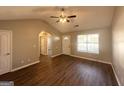 Inviting living room with wood floors, lots of natural light and front door view at 315 Breezy Hill Walk, Stockbridge, GA 30281