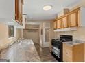 Functional kitchen featuring wood cabinets, modern appliances, and durable countertops at 351 Hemlock Ln, Locust Grove, GA 30248