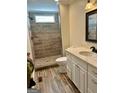 Beautifully renovated bathroom featuring a tiled shower and stylish vanity at 4941 Old Atlanta Rd, Hampton, GA 30228