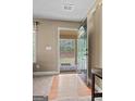 Inviting entryway with a wood door opening to a charming covered porch area at 575 Chuli Rd, Locust Grove, GA 30248